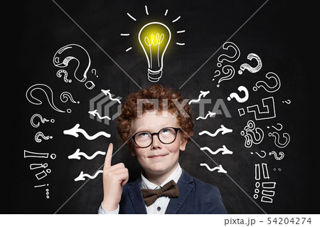 Cute boy student pointing up 54204274