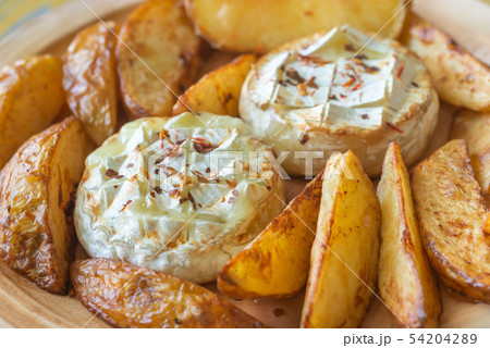 Baked Camembert cheese with potato Baked Camembert cheese with potato 54204289