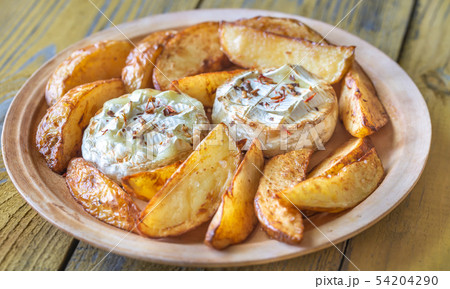 Baked Camembert cheese with potato Baked Camembert cheese with potato 54204290