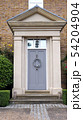 Elegant wooden grey doors with hanging wreath 54204904