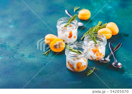 Natural yogurt with pieces of apricots and 54205070