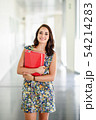Young adult student woman in a hallway of her 54214283