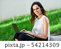 Young woman working with her laptop computer 54214309