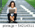 Middle-age businesswoman working with her laptop 54214311