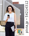 Businesswoman working with her smart phone and 54214312