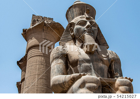 Egypt Luxor Temple. granite Statue of Ramesses II seated in front of columns 54215027