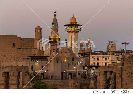 catholic Church and Muslim Mosque Tower religion Symbols together in Luxor temple at sunset catholic Church and Muslim Mosque Tower religion Symbols together in Luxor temple at sunset 54218083
