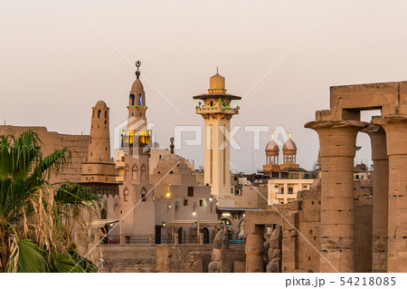 catholic Church and Muslim Mosque Tower religion Symbols together in Luxor temple at sunset catholic Church and Muslim Mosque Tower religion Symbols together in Luxor temple at sunset 54218085
