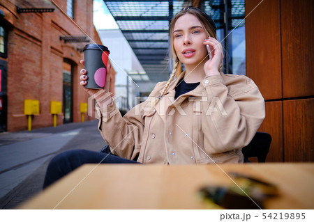 woman using smartphone in caffee shop. smart phone woman using smartphone in caffee shop. smart phone 54219895