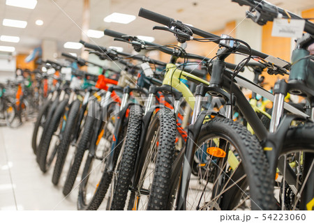 Rows of mountain bicycles in sports shop, nobody 54223060