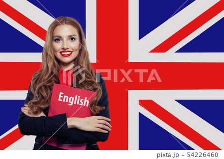 Happy woman against the UK flag background. Happy woman against the UK flag background. 54226460