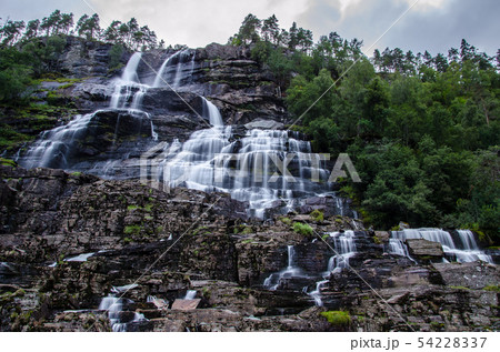 Tvindefossen waterfall in Norway photographed on long exposure during dusk 54228337