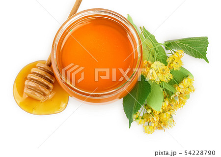 Honey with linden flowers isolated on white background. Honey with linden flowers isolated on white background. 54228790