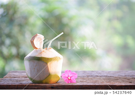 Coconut juice on wooden table at outdoor  54237640