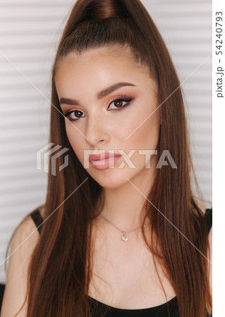 Beautiful redhead model with freckles.Background of white folding screen. Evening make up for woman Beautiful redhead model with freckles.Background of white folding screen. Evening make up for woman 54240793