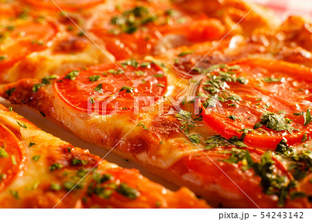 Close up piece of pizza Margarita. Delicious hot food sliced and served on white platter. Menu photo Close up piece of pizza Margarita. Delicious hot food sliced and served on white platter. Menu photo 54243142