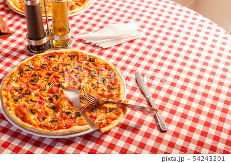 Pizza with ham and mushrooms. Delicious hot food sliced and served on white platter. Menu photo Pizza with ham and mushrooms. Delicious hot food sliced and served on white platter. Menu photo 54243201