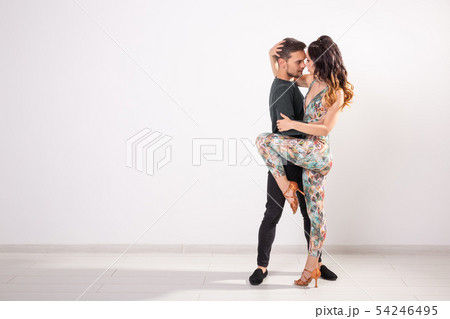 Salsa, kizomba and bachata dancers on white background with copy space. Social dance concept Salsa, kizomba and bachata dancers on white background with copy space. Social dance concept 54246495