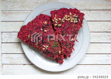 Vegan dried bread loaves on white plate on white Vegan dried bread loaves on white plate on white 54248024