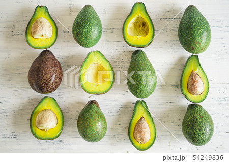 Close-Up Of Avocados On White Table Close-Up Of Avocados On White Table 54249836