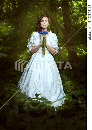Fantastic girl in a white dress with flowers 54250313