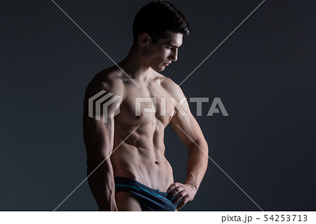 Young male athlete bodybuilder posing. Handsome athletic male power guy. Fitness muscular person 54253713