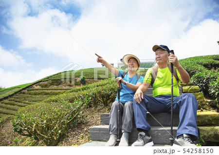 happy asian senior couple hiking in the nature happy asian senior couple hiking in the nature 54258150