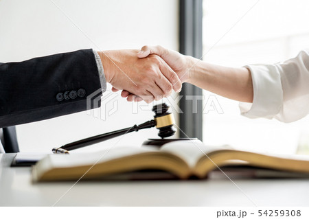 Handshake after cooperation between attorneys Handshake after cooperation between attorneys 54259308