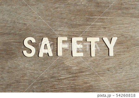 Alphabet letter in word safety on wood background Alphabet letter in word safety on wood background 54260818