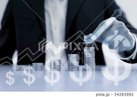 Business man putting coin on pile of money 54263992