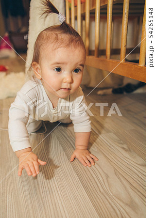 little girl with tail on head crawling on floor little girl with tail on head crawling on floor 54265148