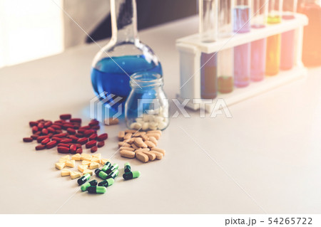 Medicine pills and tablets in research lab. Medicine pills and tablets in research lab. 54265722