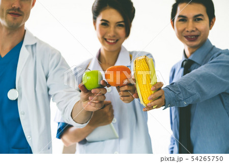 Group of nutritionist presenting healthy diet food Group of nutritionist presenting healthy diet food 54265750
