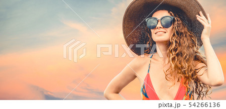 Woman in swimsuit posing on color background. 54266136