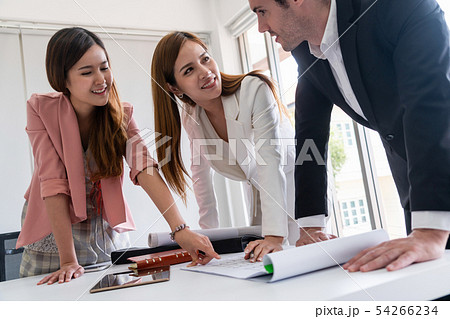 Businessman and businesswomen working in office. Businessman and businesswomen working in office. 54266234
