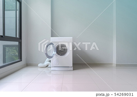 White washing machine in laundry room White washing machine in laundry room 54269031