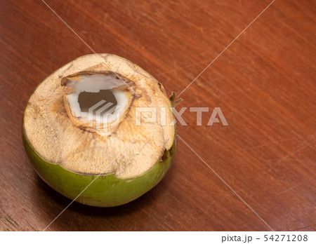 Coconut fruit opened on wooden table Coconut fruit opened on wooden table 54271208
