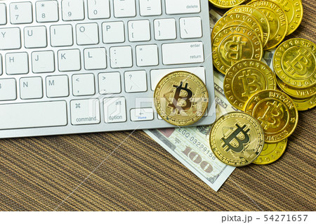 Bitcoin coin on silver keyboard for cryptocurrency Bitcoin coin on silver keyboard for cryptocurrency 54271657