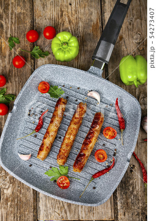 Kupaty in a frying pan Kupaty in a frying pan 54273407