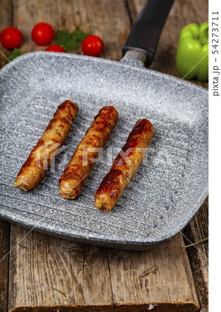 Kupaty in a frying pan 54273711