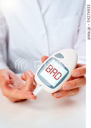 Photo of hand man with glucometer with bro inscription in studio 54274933