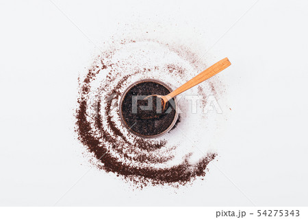 Coffee body scrub in jar with wooden spoon 54275343