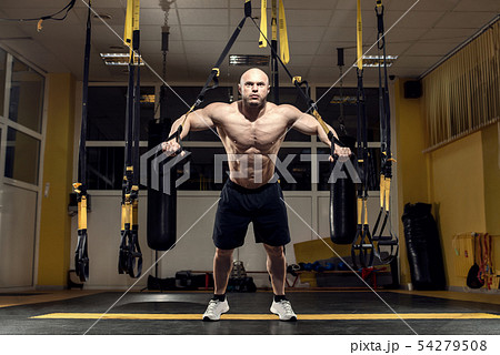 Man bodybuilder perform exercise 54279508