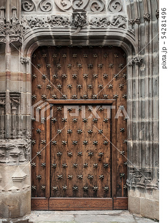 Old wooden door in a medieval building 54281496