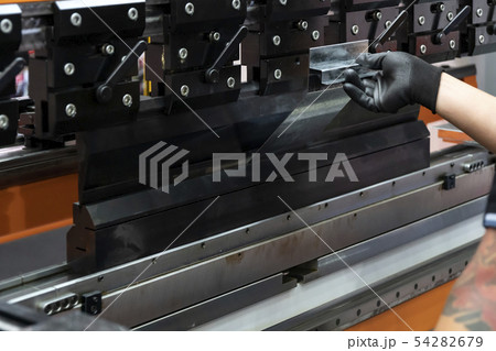 The sheet metal bending machine. The sheet metal bending machine. 54282679
