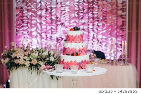 festive cake three floors decoration berries fruit 54283865