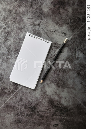 Office desk Blank note book and pencil 54284191