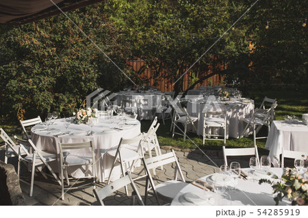 Wedding table setting decorated with fresh flowers Wedding table setting decorated with fresh flowers 54285919