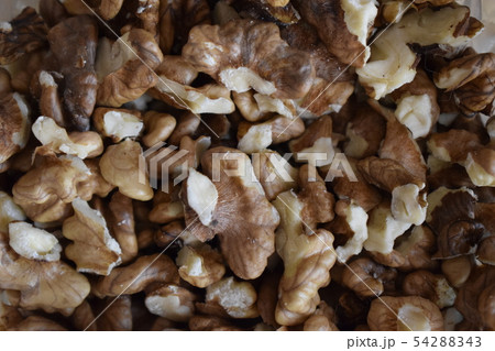 Walnut background. Peeled Nuts. Macro 54288343