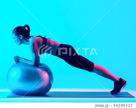 woman exercsing fitness pilates exercices isolated woman exercsing fitness pilates exercices isolated 54290327